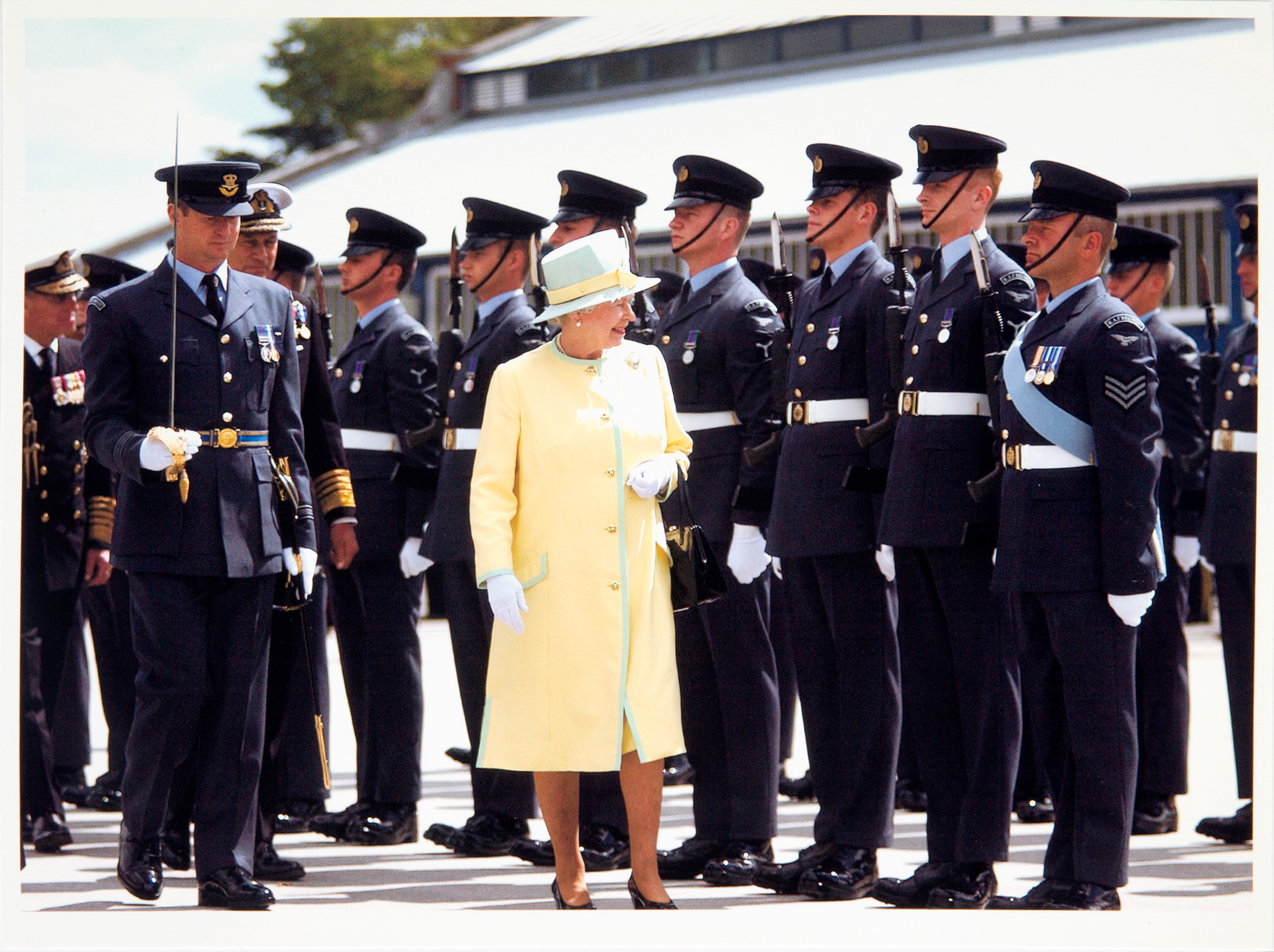 The Queen walks with Aviators on parade.